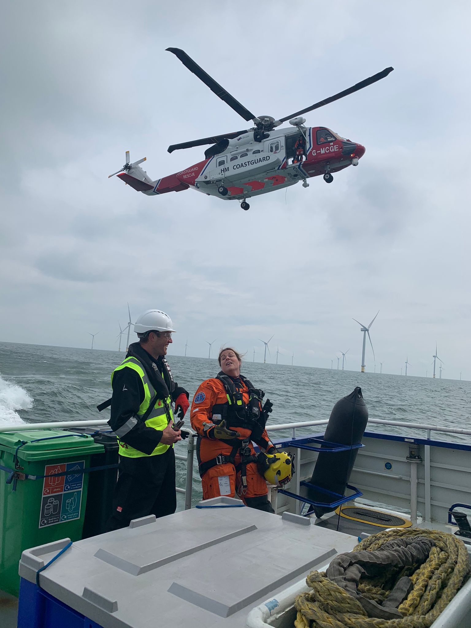 Doug Lothian and HM Coastguard crew on offshore vessel during helicopter rescue training exercise